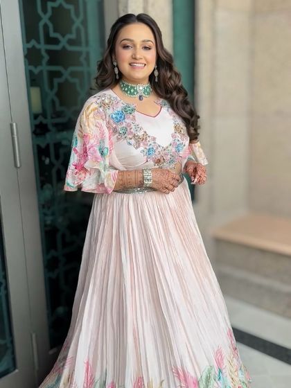 The full carnival look. The bride's colorful outfit is complemented by soft, glowing makeup and a fun, creative hairstyle.