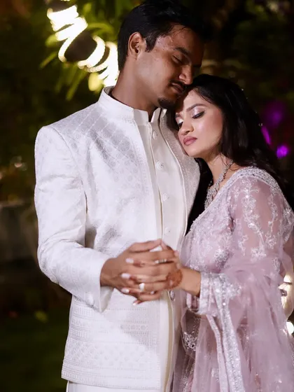 Another tender moment captured. The bride's makeup is soft and romantic, perfect for these cherished memories.