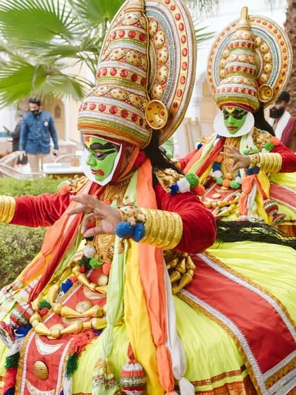 Kathakali performers in their vibrant costumes, adding an element of traditional storytelling and artistry to the celebration.