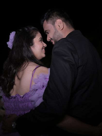 A close-up of the couple from the lavender gown shoot, capturing a sweet, romantic moment.