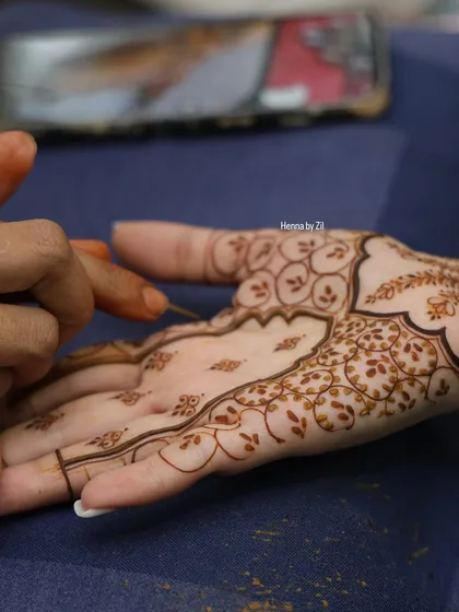 A close-up of my own minimal bridal mehendi in progress. Even simple designs require precision and a steady hand.