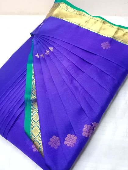 A rich indigo saree with small floral butis. The pleats are crisp and the saree is ready to be draped in under five minutes.