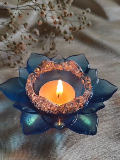 The blue lotus T-light holder, perfect for adding a pop of color to your festive decorations. I can make these in any color you like.