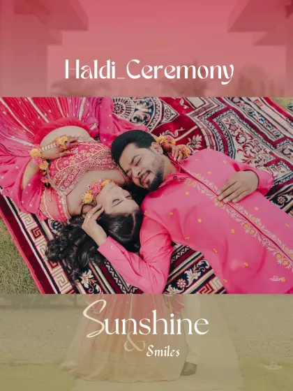 An artistic shot of the couple lying on a decorative rug, surrounded by floral decor. This top down angle provides a unique perspective of their Haldi celebration.