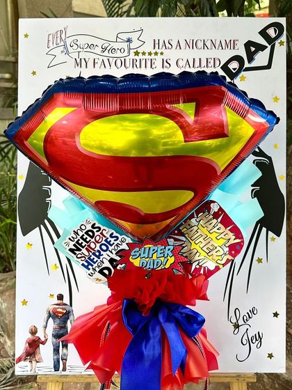 For the superhero in your life, our "Super Dad Postcard" is the perfect fit. It features a giant Superman "S" foil balloon and a fun, comic-book-style background.
