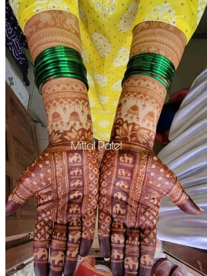 The fresh, vibrant stain of a traditional design filled with elephant motifs, shown without any filters.