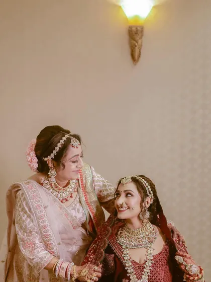 In between all the grand ceremonies, there are quiet moments of connection like this one. We focus on capturing the tender bond between a bride and her mother or sister, creating timeless portraits that you will cherish forever.