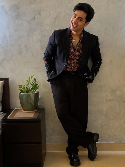 A relaxed portrait of Gagan Arora, highlighting the smart-casual outfit I put together for his 'Lafangey' promotions.