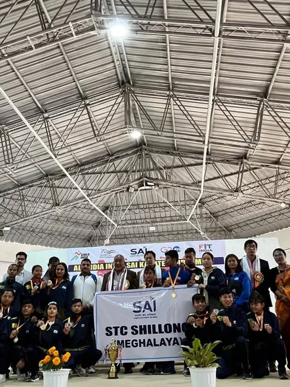 A group photo with officials and the team after receiving our runner-up trophy. It takes a whole community of support to achieve these results.