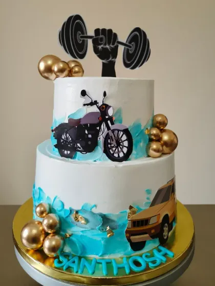 A grand 50th birthday cake for a fan of cars, bikes, and the gym. This two-tier version really makes a statement.