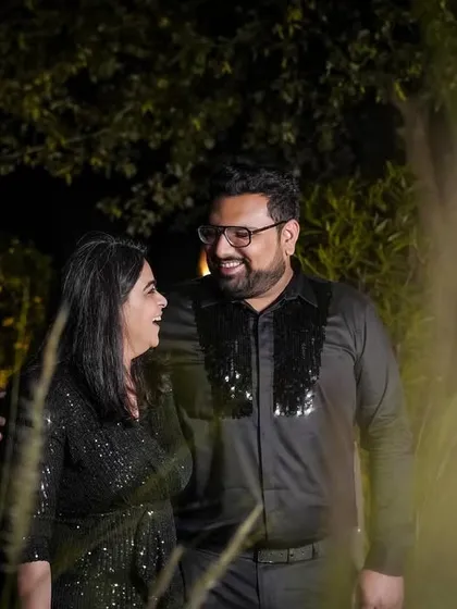 A candid photograph of the couple sharing a look and a smile. These are the small, in-between moments that truly reflect a couple's connection.