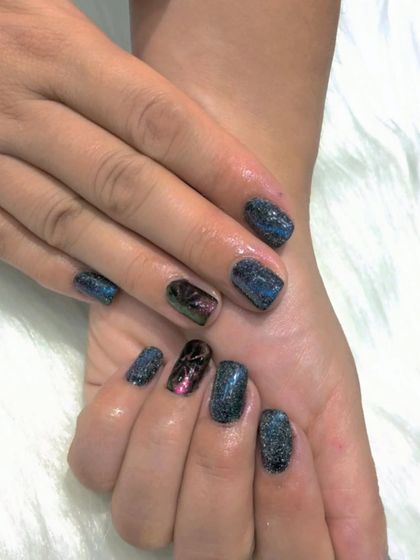 A still shot of the cat eye nails, showing the depth and sparkle of the finish.