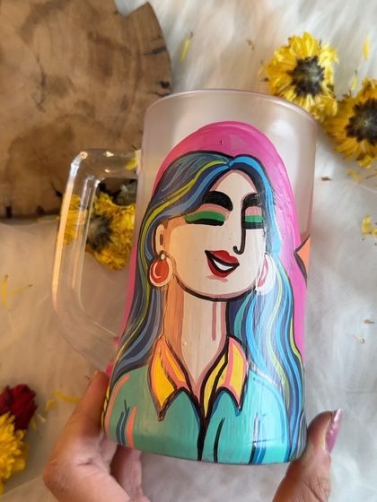 The same colorful beer mug, showing how the light catches the frosted glass.