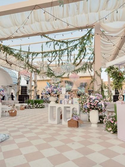 Another view of the terrace garden Mehendi, showing the layout with its various stations and seating areas, all tied together with a cohesive pastel and floral theme.