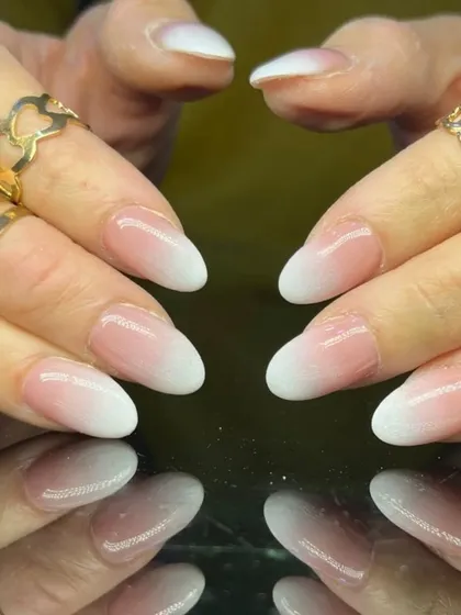 A clean and simple baby boomer ombre on almond nails, a timeless and versatile choice.