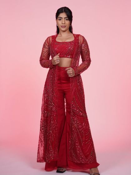 Another look at the red three-piece Indo-Western set, a perfect choice for anyone wanting to make a bold fashion statement.