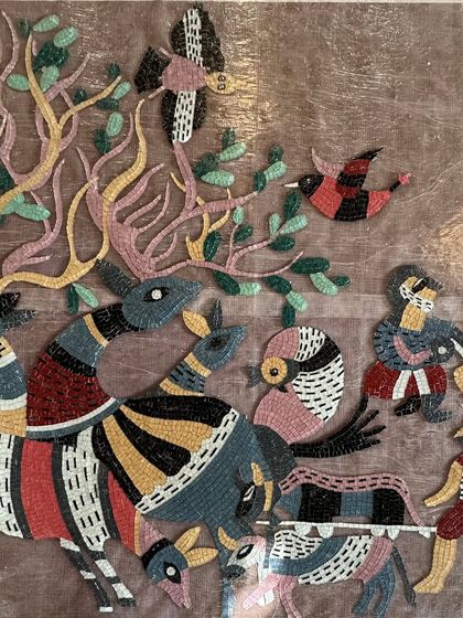 A detail showing the variety of creatures and patterns within the handcrafted glass mosaic.