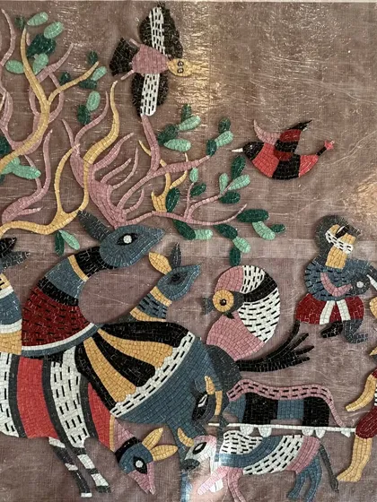 A detail showing the variety of creatures and patterns within the handcrafted glass mosaic.