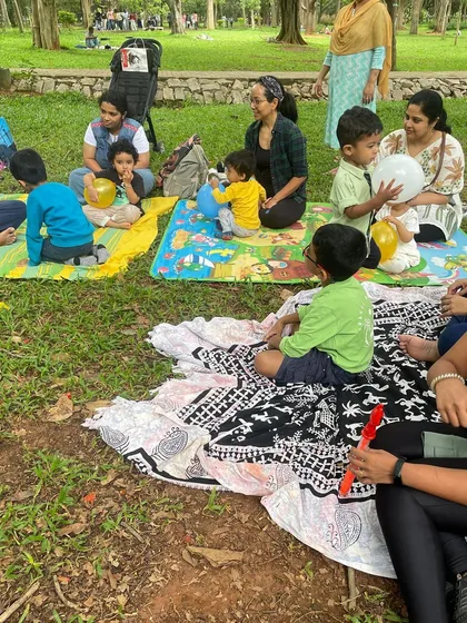Parents and children sitting together, enjoying the story. We create a space where families can connect with each other and with new friends.