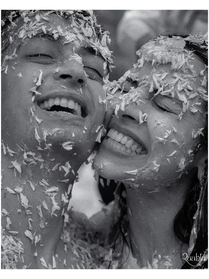 Pure, unadulterated joy. This candid black and white shot from Amala and Aditya's haldi ceremony is what we live for, capturing the real emotions and happy chaos that make a wedding memorable.