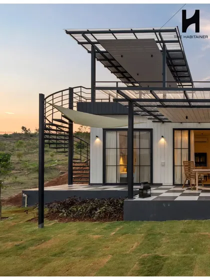 This French-themed prefab villa showcases our ability to execute specific aesthetic visions. Featuring a rooftop deck with a spiral staircase and a distinctive checkered patio, it’s a testament to our custom design capabilities and attention to detail.
