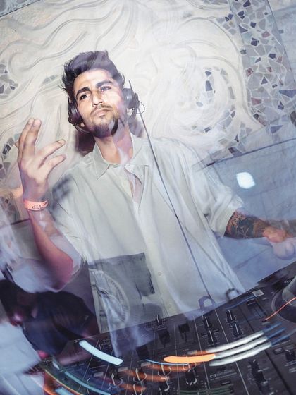 An artistic, multi-exposure shot capturing my movement and energy at the DJ console. This reflects the dynamic and layered nature of my music sets.
