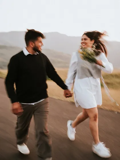A motion-blur shot of Monil and Charmi running and laughing. This technique adds a sense of energy, fun, and spontaneity to the photograph.