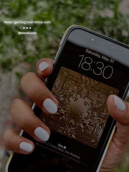 Never getting over white nails. A simple, clean white gel polish on short nails.