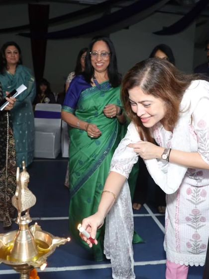 The lamp lighting ceremony marks the beginning of the 'Carpe Diem' literary event, with school faculty and guests participating in this auspicious tradition.