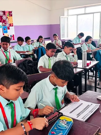 A snapshot of a typical day at my academy. Here, students are deeply focused, using their abacus tools to solve problems. I ensure every child gets the space and guidance they need to master their calculation skills.