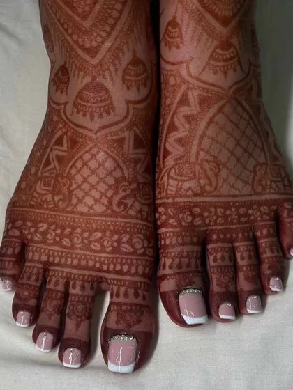 Perfect toes for your big day or any day. We used acrylic extensions to create flawless, natural-looking toenails, finished with a classic French pedicure and a touch of bling. This look is perfect for bridal events and lasts for weeks.