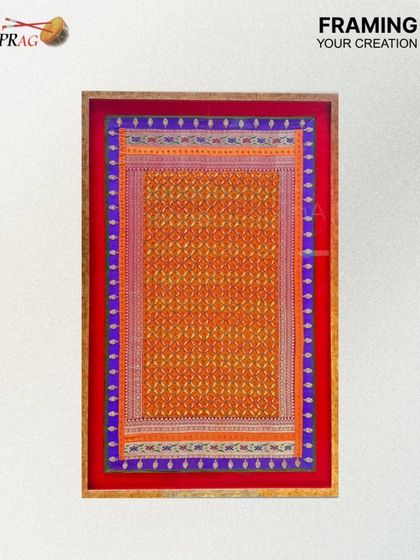 The specifications for this textile piece include an antique gold frame and a bold mount color, chosen to make the traditional patterns pop. It is a perfect example of framing your creation with care.