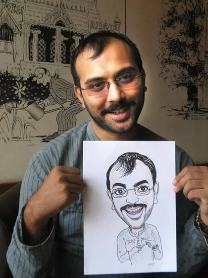 This guest is all smiles holding his caricature. My goal is to provide not just a drawing, but a fun and memorable experience.