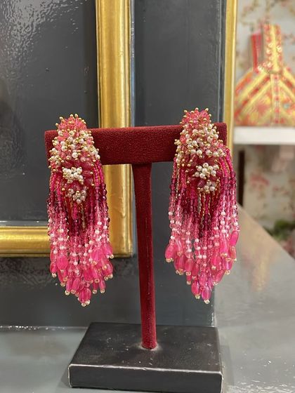 These ombre pink tassel earrings are handcrafted with tiny beads and pearls, creating a stunning waterfall effect.