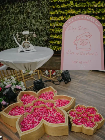 We believe in details that delight guests, like this unique audio guestbook station with a vintage telephone and flower-shaped trays holding fresh petals. It’s these personal touches that make a celebration unforgettable.