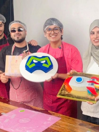 The full crew from the S8UL gaming team posing with the cakes we created together during the IRL baking live stream. The event was a fun and successful blend of gaming culture and baking.