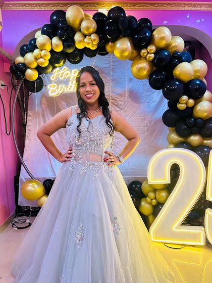 A full-length shot of the birthday girl in her rented gown. She looks absolutely radiant.