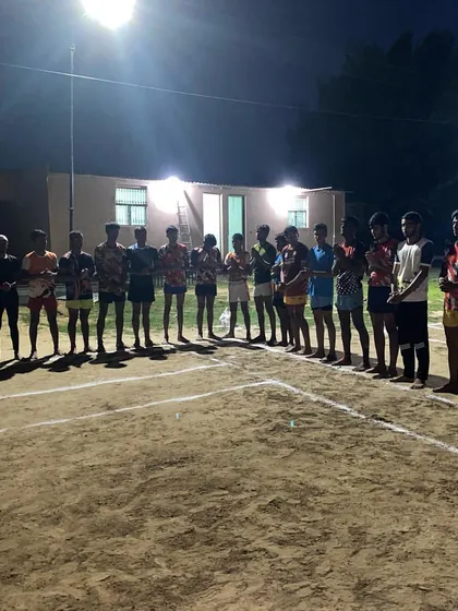 The team lines up for a prayer on a Tuesday evening, a tradition at our academy.