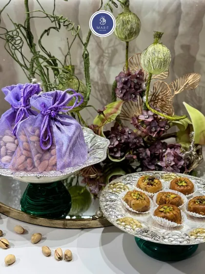 A beautiful serving arrangement featuring the Emerald Glow Bowl and Gulzar Platter. Together, they create a stunning and cohesive look for your festive table.