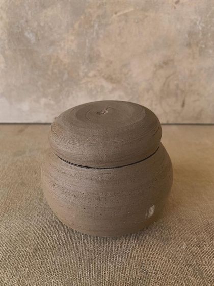 A rounded, unglazed lidded jar, waiting to be fired. I love this stage of the process, where the form is complete but its final character is yet to be revealed.