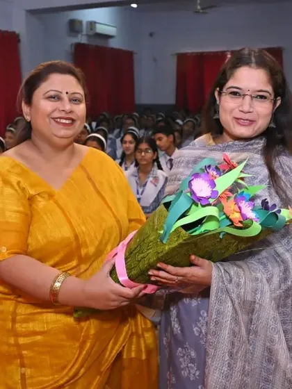 Being welcomed with a bouquet at a school session. It is always rewarding to connect with students.