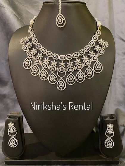 This elegant diamond-look necklace set with matching earrings is a popular rental for receptions and parties.