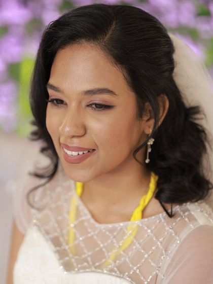 My bride Aruna, looking serene and beautiful for her church wedding. We did a soft, shimmery eye and a natural lip for a timeless look.