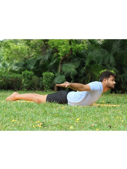 Salabhasana (Locust Pose) is a simple but powerful backbend that strengthens the entire back of the body, from the neck to the heels. It's an essential pose for building the strength needed for deeper backbends.