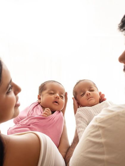 Double the blessing. This photo of parents gazing at their newborn twins is just filled with so much love and wonder. A truly precious moment.