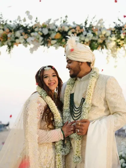 A happy portrait of the couple. The bride's makeup is radiant and subtle, a perfect example of modern bridal elegance.