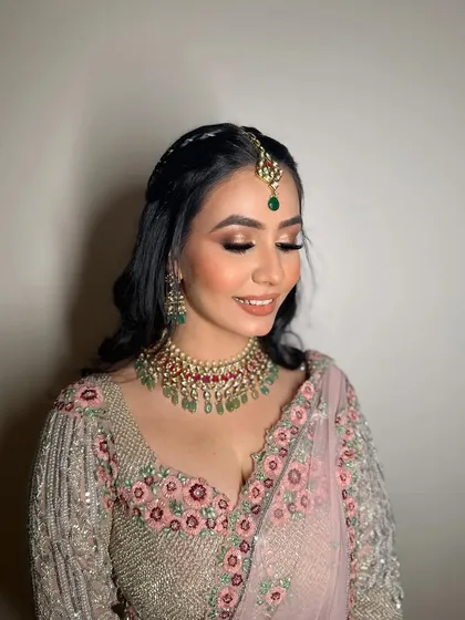 A close-up of Amanpreet's makeup, showcasing the soft, blended eyeshadow and the radiant skin that every bride dreams of.