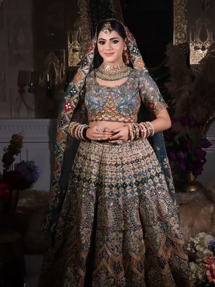 A smiling bride, radiating happiness. The makeup is designed to last through all the emotions of the big day.