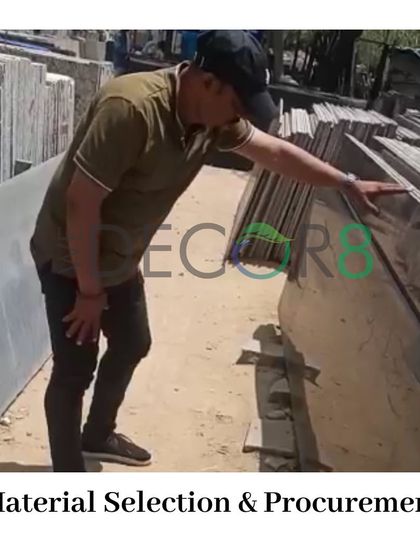 Material selection is a critical step. A member of our team is carefully inspecting stone slabs to ensure we procure only the highest quality materials for our hardscaping and design projects.