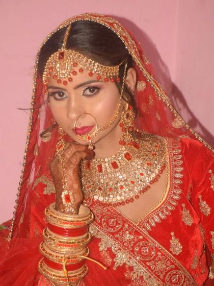 A confident portrait of the bride. The makeup is bold and beautiful, with a focus on defined eyes and lips.